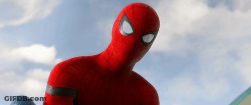 A Close Up Of A Spiderman 'S Face Against A Blue Sky GIF