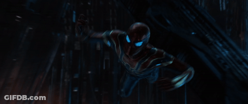 A Close Up Of A Spiderman With Blue Eyes Holding A Spider Web GIF