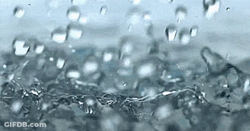 A Close Up Of A Splash Of Water With Bubbles GIF