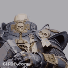 A Close Up Of A Statue Of A Knight With A Skull On His Chest And Shoulder . GIF