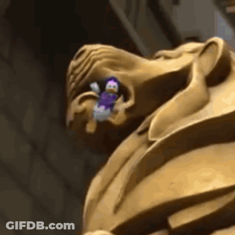 A Close Up Of A Statue Of A Man With A Purple Object In His Mouth GIF