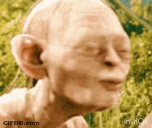A Close Up Of A Statue Of Gollum From The Lord Of The Rings . GIF