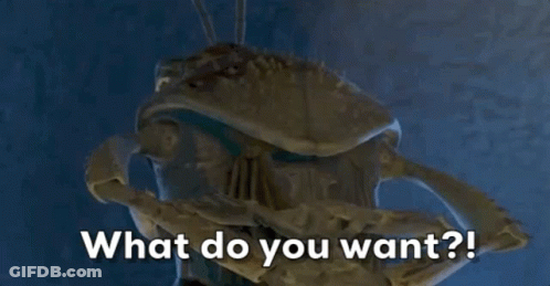 A Close Up Of A Statue With The Words What Do You Want Written On It GIF