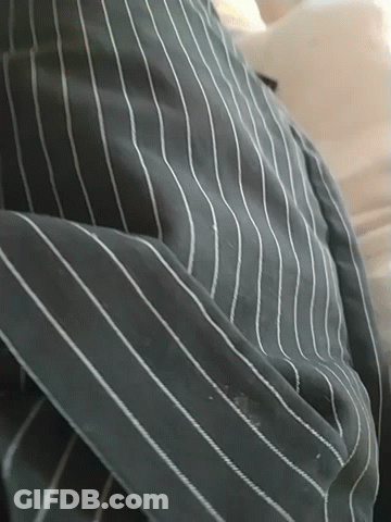 A Close Up Of A Striped Shirt With White Stripes On It GIF