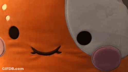A Close Up Of A Stuffed Animal 'S Face GIF