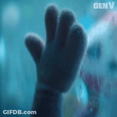 A Close Up Of A Stuffed Animal 'S Hand Behind A Glass With Genv Written On It GIF