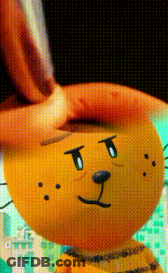 A Close Up Of A Stuffed Animal That Looks Like A Cat GIF