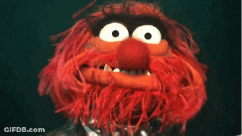 A Close Up Of A Stuffed Animal With A Big Mouth GIF