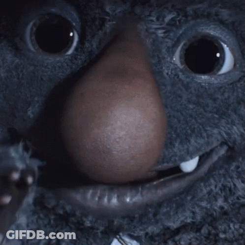 A Close Up Of A Stuffed Animal With A Big Nose GIF
