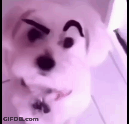 A Close Up Of A Stuffed Animal With A Cartoon Face . GIF