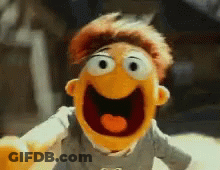 A Close Up Of A Stuffed Animal With A Heart In Its Mouth . GIF