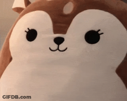A Close Up Of A Stuffed Animal With A Squirrel Face GIF