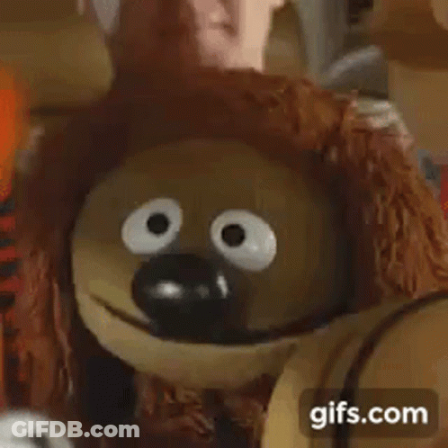 A Close Up Of A Stuffed Animal With Big Eyes And The Words Classic Gifs.com . GIF