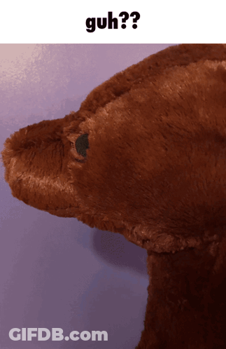 A Close Up Of A Stuffed Animal With The Word Guh On The Bottom GIF
