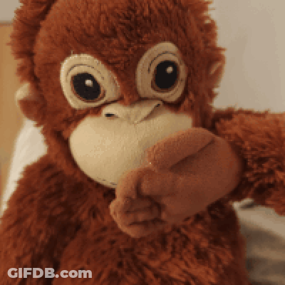 A Close Up Of A Stuffed Monkey Covering Its Mouth With Its Hand GIF