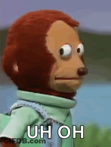 A Close Up Of A Stuffed Monkey With The Words Uh Oh On It GIF