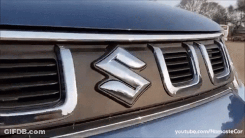 A Close Up Of A Suzuki Logo On A Car GIF