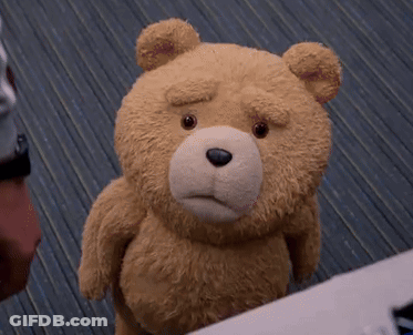 A Close Up Of A Teddy Bear With A Sad Face GIF