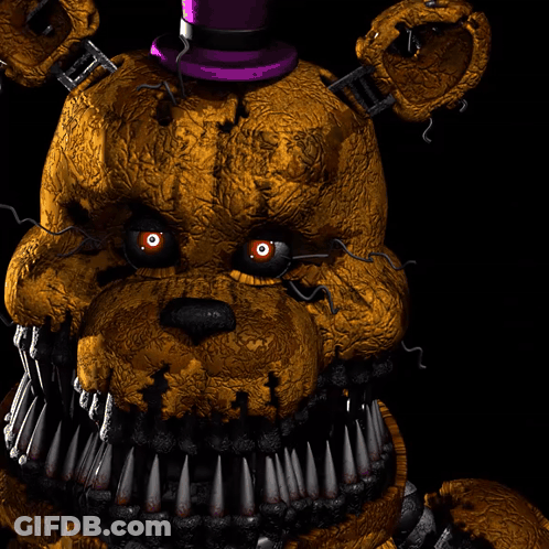 A Close Up Of A Teddy Bear With Sharp Teeth And A Purple Top GIF