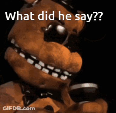 A Close Up Of A Teddy Bear With The Words " What Did He Say " Above It GIF