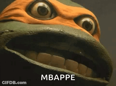 A Close Up Of A Teenage Mutant Ninja Turtle 'S Face With Its Mouth Open And The Words Mbappe Written On It . GIF