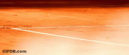 A Close Up Of A Tennis Court With White Lines GIF