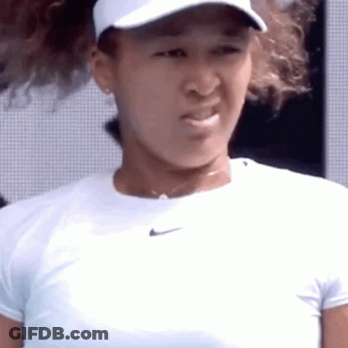 A Close Up Of A Tennis Player Wearing A White Hat And A White Shirt . GIF