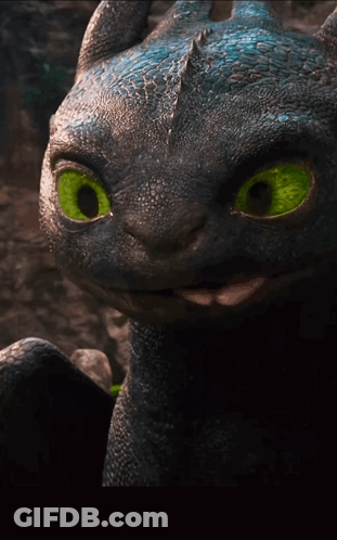 A Close Up Of A Toothless Dragon With Bright Green Eyes GIF