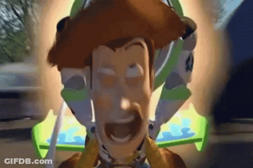 A Close Up Of A Toy Story Character With Buzz Lightyear Behind Him GIF