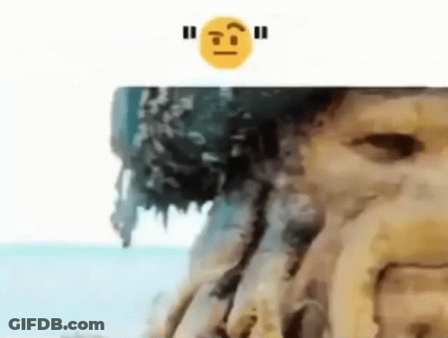 A Close Up Of A Tree Trunk With A Smiley Face Above It . GIF