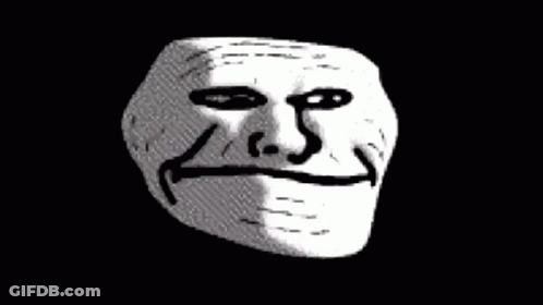 A Close Up Of A Troll Face On A Black Background GIF