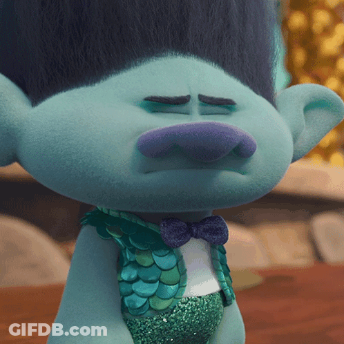 A Close Up Of A Troll With A Bow Tie GIF