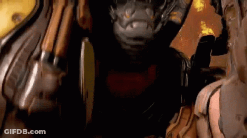 A Close Up Of A Video Game Character In A Dark Room With Fire In The Background . GIF