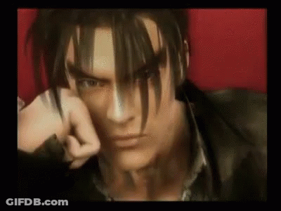 A Close Up Of A Video Game Character 'S Face With A Fist In His Hand . GIF