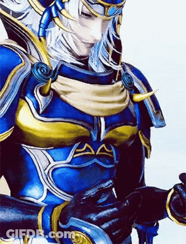 A Close Up Of A Video Game Character Wearing A Blue And Gold Armor And Gloves . GIF