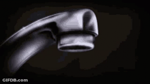 A Close Up Of A Water Faucet With Water Dripping From It . GIF