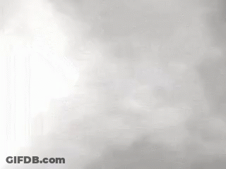 A Close Up Of A Waterfall With A Lot Of Fog Coming Out Of It . GIF
