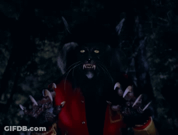 A Close Up Of A Werewolf 'S Claws And Eyes GIF