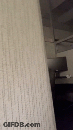 A Close Up Of A White Carpet With A Diagonal Pattern GIF