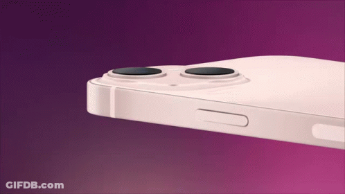 A Close Up Of A White Iphone With Two Cameras On A Purple Background . GIF