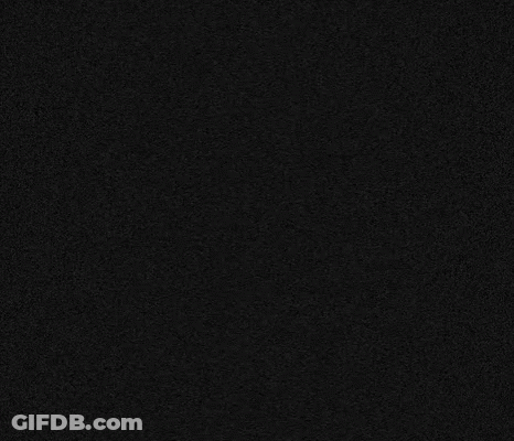 A Close Up Of A White Symbol On A Black Surface . GIF