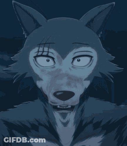 A Close Up Of A Wolf 'S Face With Its Tongue Out GIF