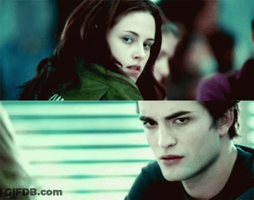 A Close Up Of A Woman And A Close Up Of A Man Looking At Each Other GIF
