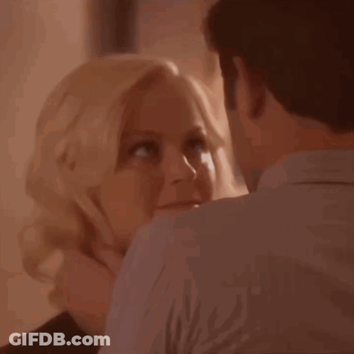 A Close Up Of A Woman And A Man With The Words Uh Oh On The Bottom GIF