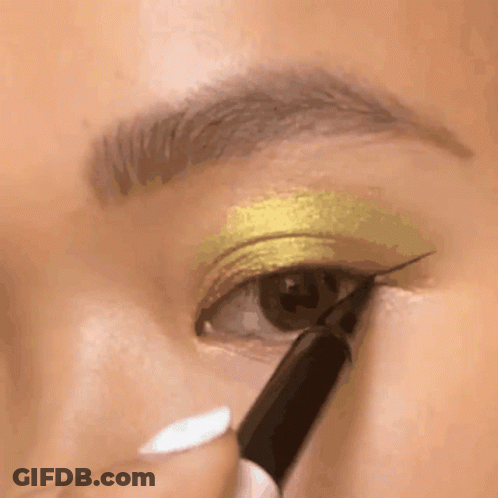 A Close Up Of A Woman Applying Eye Shadow GIF