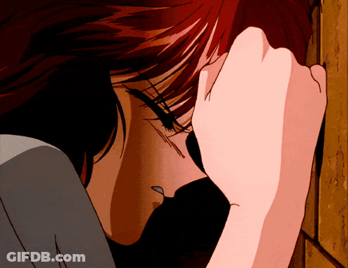 A Close Up Of A Woman Covering Her Face With Her Hand GIF