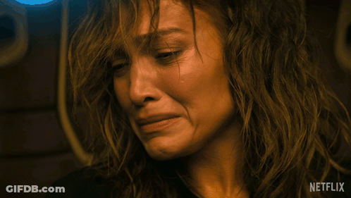 Close Up Of Woman Crying With Netflix Logo GIF