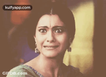 A Close Up Of A Woman Crying With The Words Kulfyapp.com Above Her GIF