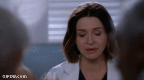 A Close Up Of A Woman In A Lab Coat GIF