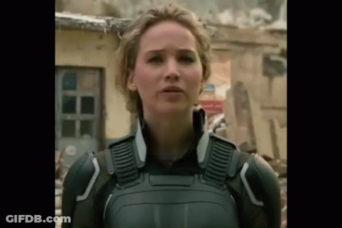 A Close Up Of A Woman In A Military Uniform Standing In Front Of A Building . GIF